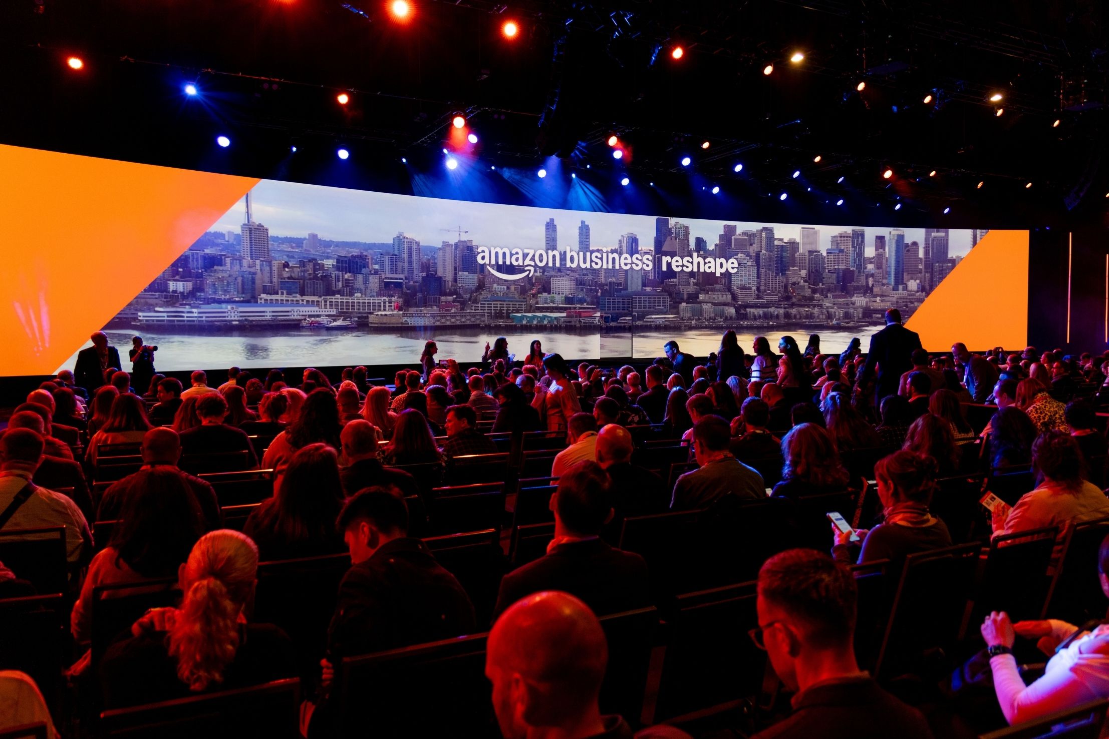 Amazon Business Reshape attendees watch a session
